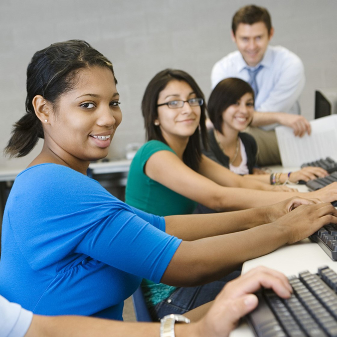 students working at computers in a classroom